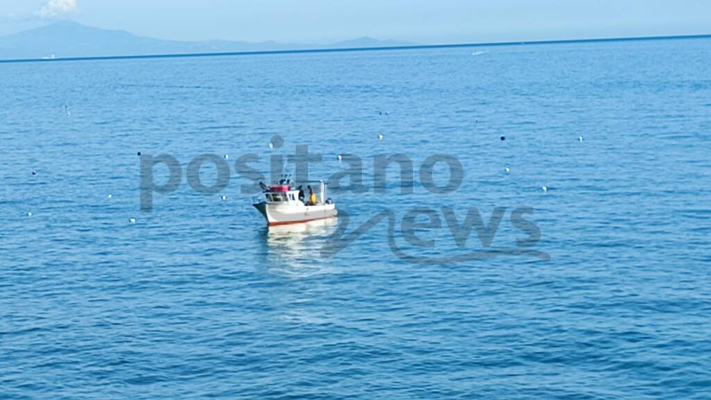 Positano, sulla Spiaggia Grande shooting fotografico per una ditta tedesca di abbigliamento